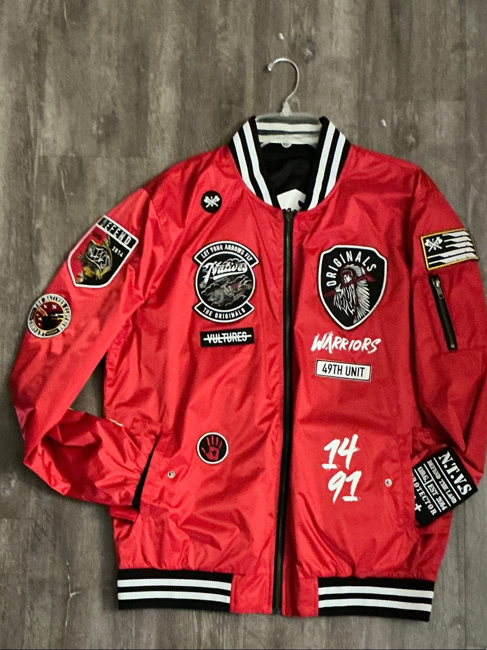 Red unisex bomber jacket from the brand The NTVS (The Native Anthology)